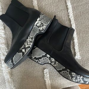 Black platform snakeskin booties